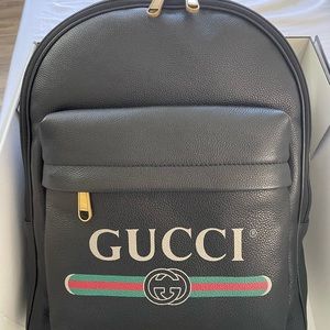 Gucci print logo leather backpack